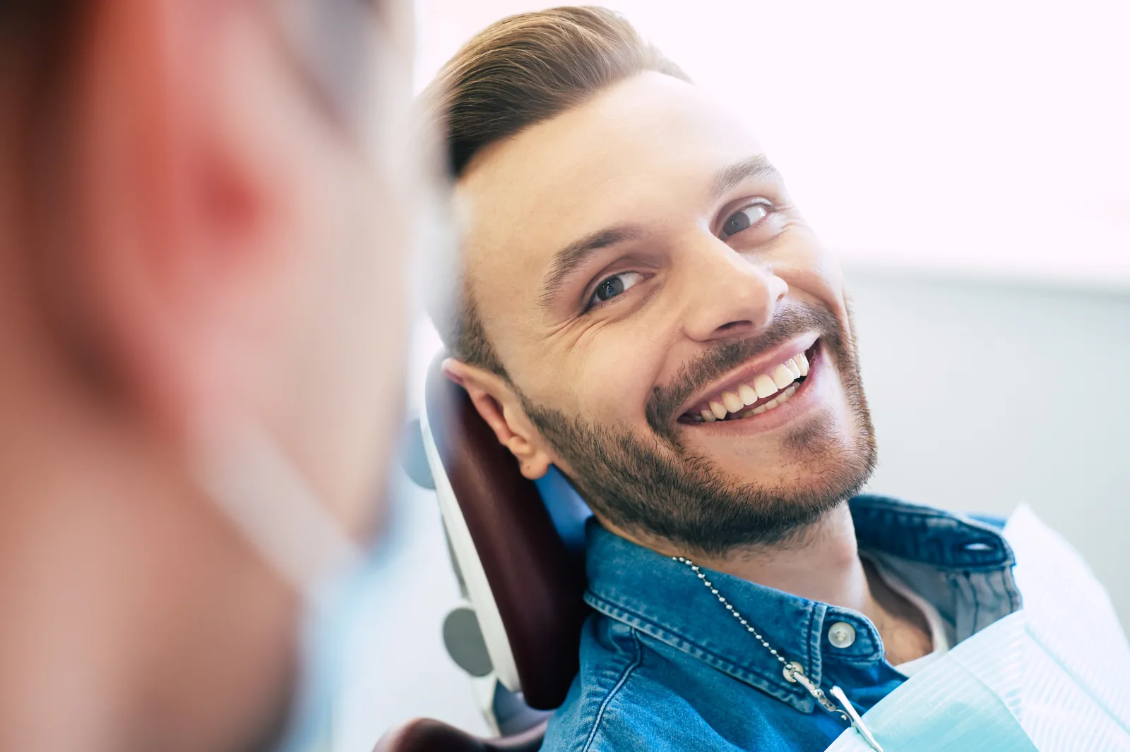 Patient smiling after a dental visit at Diamondback Dentistry