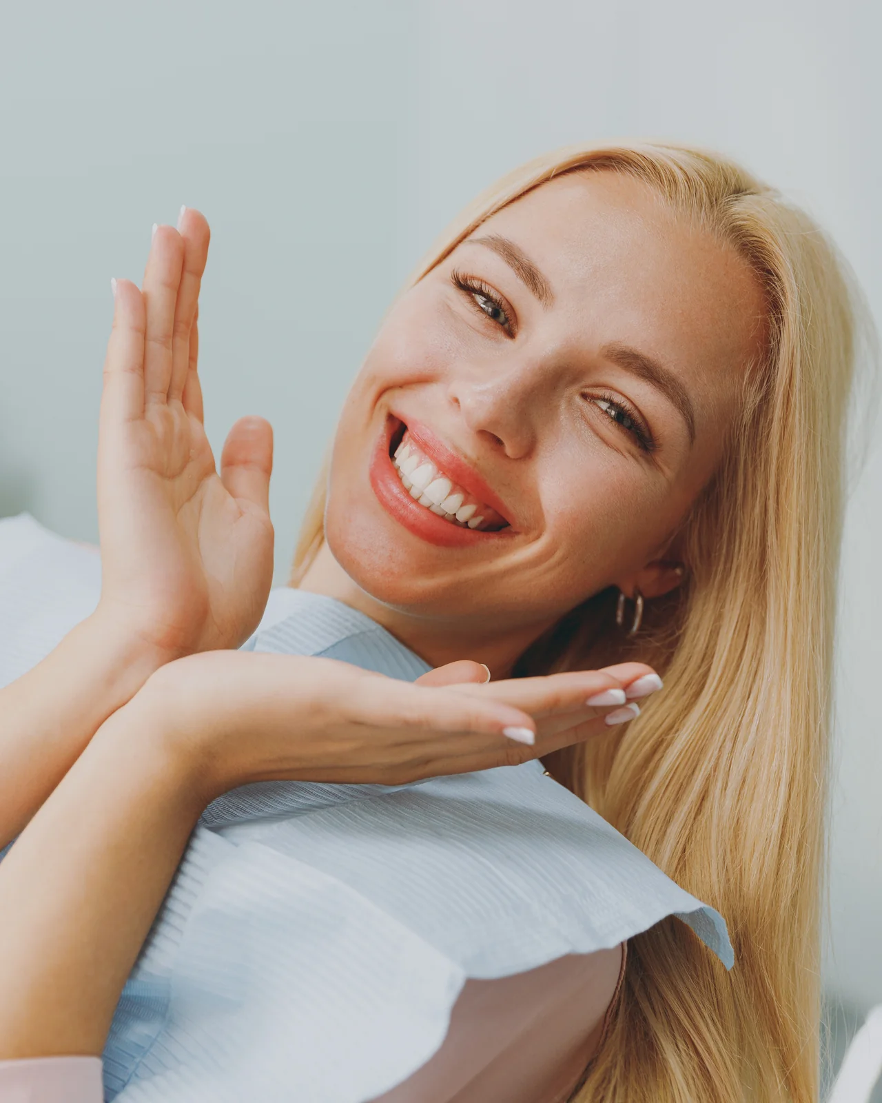 Mature North Phoenix patient smiling confidently after All-on-4 dental implants at Diamondback Dentistry
